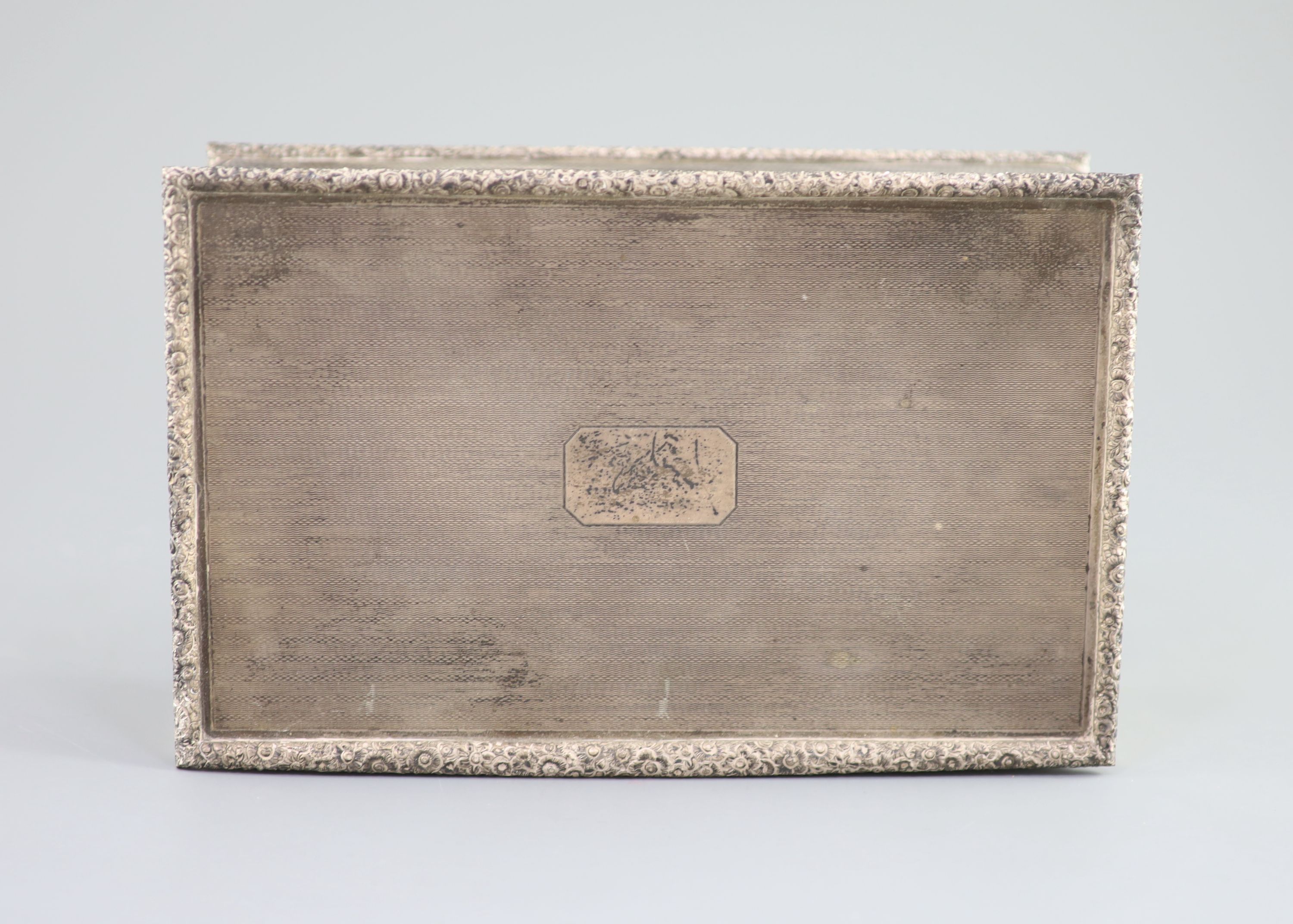 A 1950's engine turned silver rectangular cigarette box, by Mappin & Webb, 21.1cm, gross 35oz.